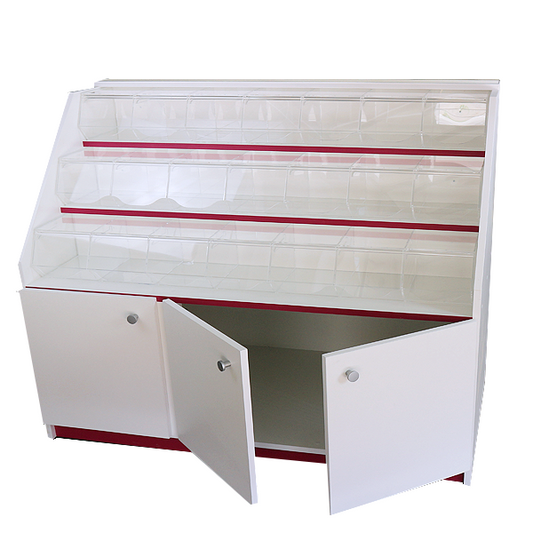 Mueble expositor con carameleras de metacrilato y compartimentos inferiores con puertas, ideal para la exhibición de productos a granel. Diseño funcional, seguro y adaptable a distintos espacios comerciales
