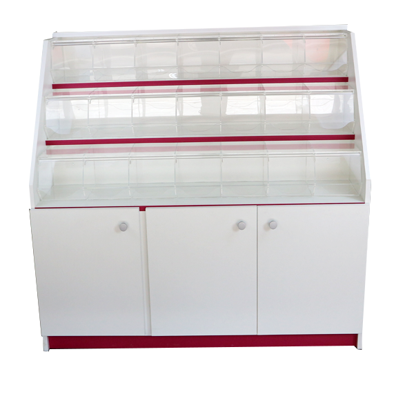 Mueble expositor con carameleras de metacrilato y compartimentos inferiores con puertas, ideal para la exhibición de productos a granel.  Diseño funcional, seguro y adaptable a distintos espacios comerciales